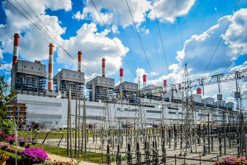 A power plant with lots of power lines in front of it, illustrating long-term energy asset planning
